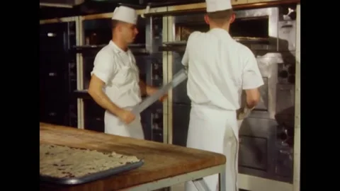 1968 - US Navy cooks take cobbler out of the oven for Easter. Stock Footage 161014280