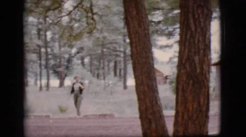 1968: a woman goes for a stroll and waves at the camera COTTONWOOD, ARIZONA Stock Footage