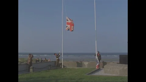 1969 - Allied flags are raised at the dedication of a monument in a ceremony Stock Footage 103318320