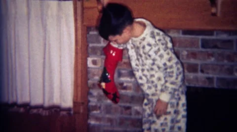 1969: Boy Digs Baseball Card Package Gift from Christmas Stocking in Boulder, Stock Footage 58842047