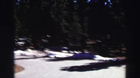 1969: clear road with snowbanks on the side surrounded by trees YOSEMITE, Stock Footage