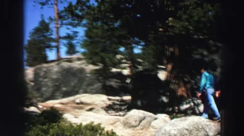 1969: a man walking up the path along a beautiful mountain ridge YOSEMITE, Stock Footage