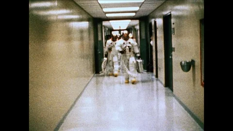 1969 NASA APOLLO 11: astronauts walk hallway Stock Footage