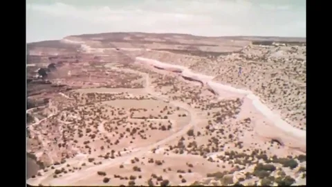 1969 - Nuclear energy powers cities. A uranium mine is shown. Stock Footage 120038095