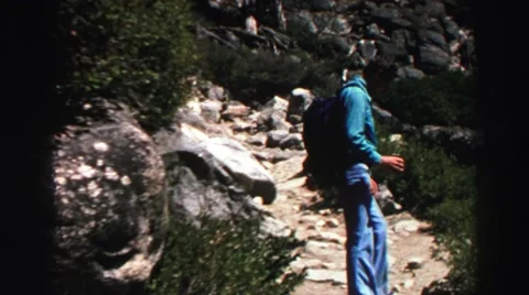1969: one man stand on front of the hill YOSEMITE, CALIFORNIA Stock Footage