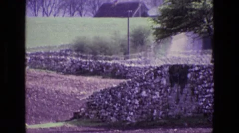 1969: an outdoor beach is seen with people diving in the water ENGLAND Stock Footage