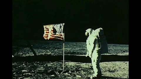 1969 - As photographs of the first moon landing are shown, interviews are heard Stock Footage