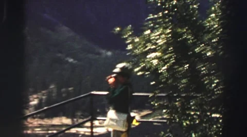 1969: the woman watching something beside the big mountain YOSEMITE, CALIFORNIA Stock Footage