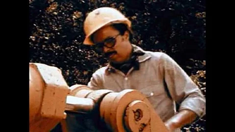 1970 - A worker, afraid to seem unmanly for being overly cautious, is wounded Stock Footage 115664681