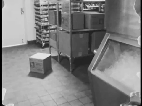 1970s _ A Jack in the Box injures his back picking up a heavy box the wrong way. Stock Footage