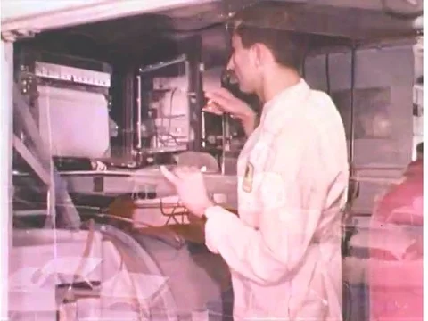 1970s _ Scientists conduct research in a smog research chamber at a GM facility. Stock Footage