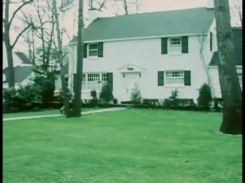 1970s _ A teen sells hassocks door to door during a Junior Achievement program. Stock Footage