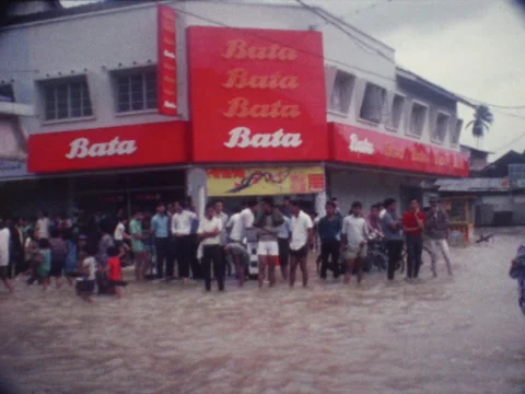 1970s Bata storefront during a tropical flood Stock Footage 147373756
