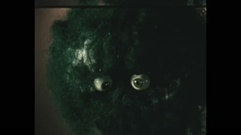 1970s: Boy in elaborate monster makeup. Numbers floating across the screen. Stock Footage 189940079