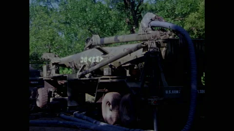 1970s: Cable connects vehicles.  Control panel.  Missile fins move.  Man turns Stock Footage 159168285