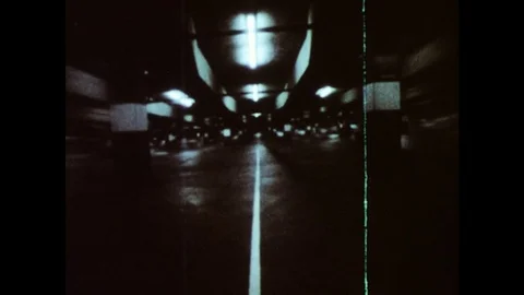 1970s: car drives along dark street and slams on brakes. Stock Footage