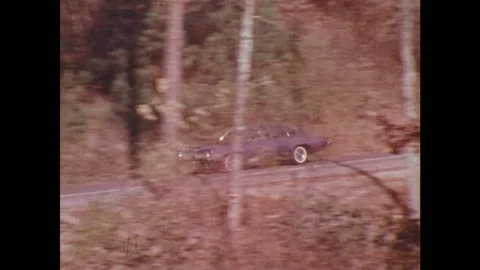 1970s: Car driving on road / Animation of engine / Car driving on bridge / Man Stock Footage