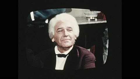 1970s: Children watching T.V.. Show on T.V.. Family in living room watching Stock Footage 139499237