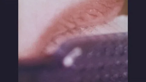 1970s: Closeup of teeth being brushed and flossed, then the gums bleeding; Stock Footage 77253094