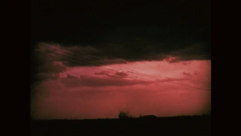 1970s: Clouds on horizon. Torando. Another tornado. Tornado tears across ground. Stock Footage 121588178