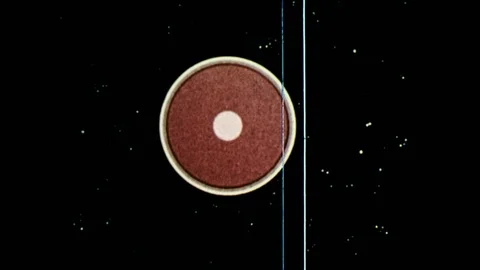 1970s: Cross-section of moon.  Animation shows lines forming around moon.  Comet Stock Footage 86808973