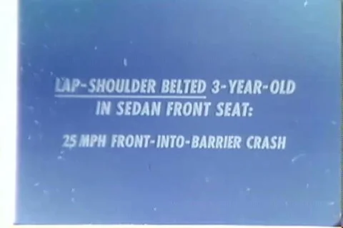 1970s - Dummy crash tests of a lap belted 3 year old in the front and rear seats Stock-Footage 87151206