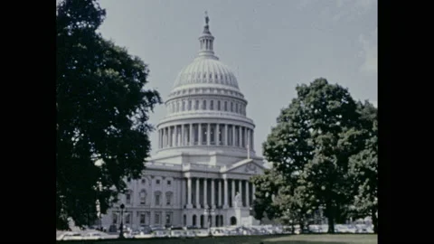 1970s: Entry on Washington D.C. in encyclopedia. Capitol Building. New York Stock Footage 157928058