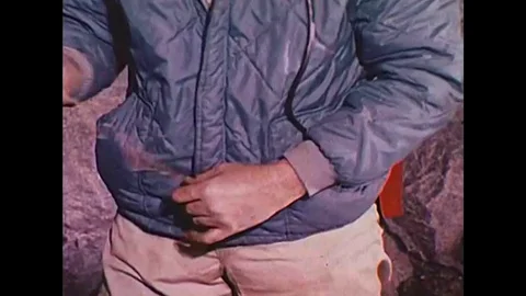 1970s - Explosives are loaded in a mine, and extra explosives are removed in a Video stock 132199891