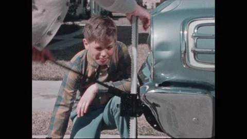 1970s: father showing son how to use car... | Stock Video | Pond5