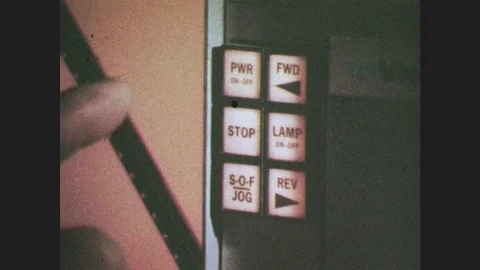 1970s: Finger presses forward button, it lights up. Hand holds remote control Видео 86683212