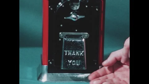 1970s: Hands get gumball from machine, zoom out, equation appears, hands turn Stock Footage 268626311