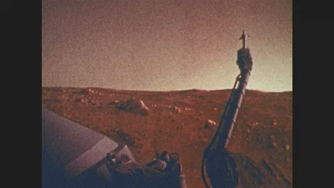 1970s: Image of lander on Mars' surface, fading to dark with stars and planets Stock Footage 86687956