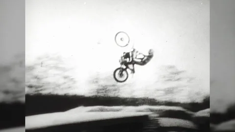 1970s Insane Crazy Man Motorcycle Stunt Jump Over Cars Deadly Vintage Film Movie Stock Footage