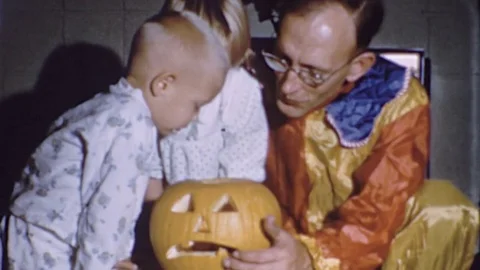 1970s Kids Children Halloween With Dad Father Pumpkin Vintage Film Home Movie Stock Footage
