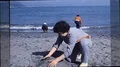 1970s Kids Play at Beach Waves Shore Sandcastle Sand Playing Vintage Film Movie HD Footage