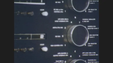 1970s: Knobs and dials.  Reel to reel tape player.  Switches.  Lights blink.  Stock Footage 80059131
