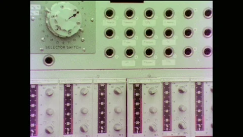 1970s: Knobs, dials and holes on lab equipment. Lights blink on lab equipment. 스톡 동영상 90349128