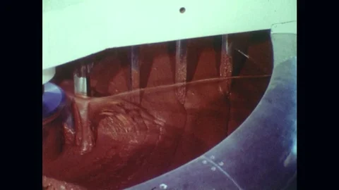 1970s: Machine mixes chocolate. Stock Footage 74921042