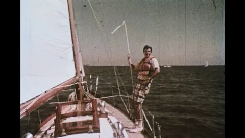 1970s: man on a sailing boat Stock Footage 74760039