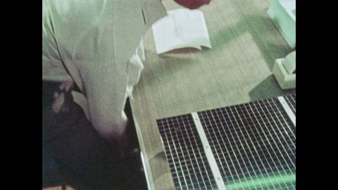 1970s: Man at a table stuffs envelopes. Man opens and reads mail. Woman speaks Stock Footage 92589560