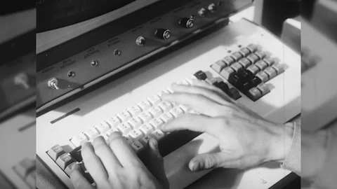 1970s Man Working Personal Computer Monitor Keyboard Desktop Vintage Film Movie Stock Footage 87293428
