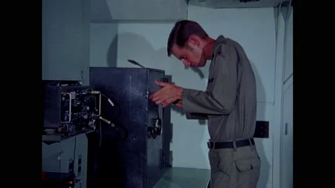 1970s: Men enter codes in safe and take out keys and folder labeled "TOP Stock Footage 159168389