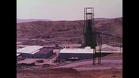1970s - Miners take an elevator down to a mine, and undergo safety procedures in Stock Footage 132203304