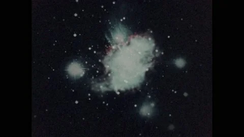 1970s: Nebulas, binary stars and clouds hang among stars in galaxy. Clusters of Video stock 232182834