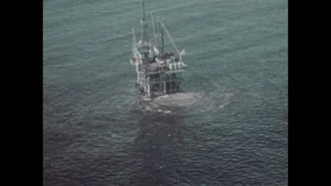 1970s: oil rig in ocean, sunken ships, l... | Stock Video | Pond5