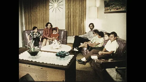1970s: One-sheet for dance performance. Family sits in living watching T.V.. Stock Footage