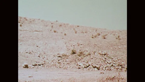 1970s: pipe bomb exploding in desert Stock Footage 121590298