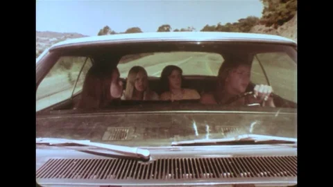 1970s - Police chase speeding car down mountain road. Stock Footage