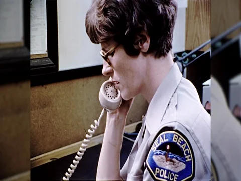 1970s Police Woman Department Dispatch Gets Call Report Crime Vintage Film Movie Stock Footage