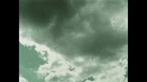 1970s: Rain clouds. Rain storm. Rain falls on plants. Desert basin. Moon surface Vídeo Stock 270242899